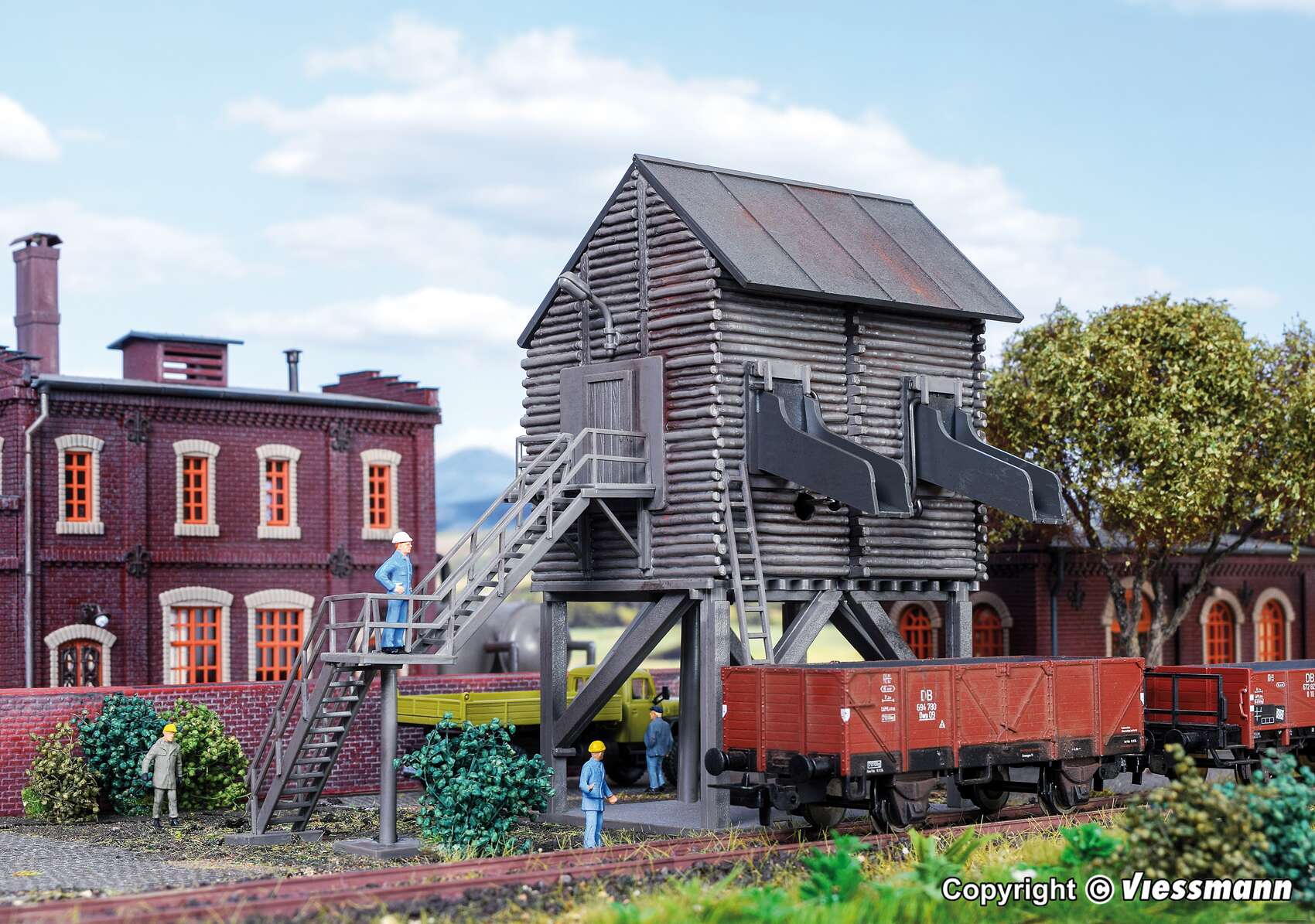 Gravel loader terminal with motor-driven locking flaps, functional kit