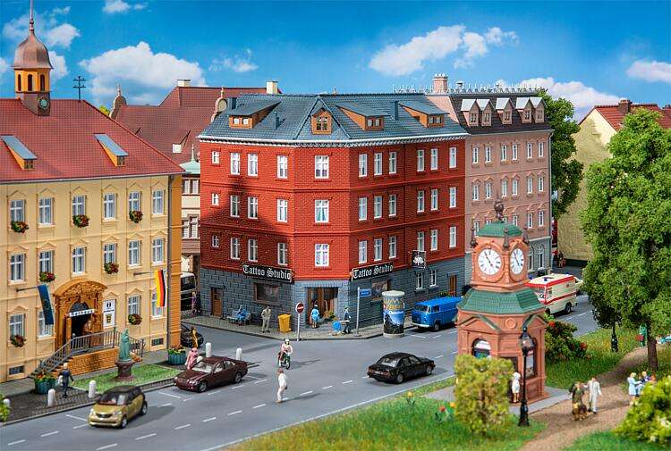 Town corner house with tattoo parlour