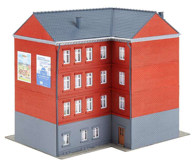 Town corner house with tattoo parlour