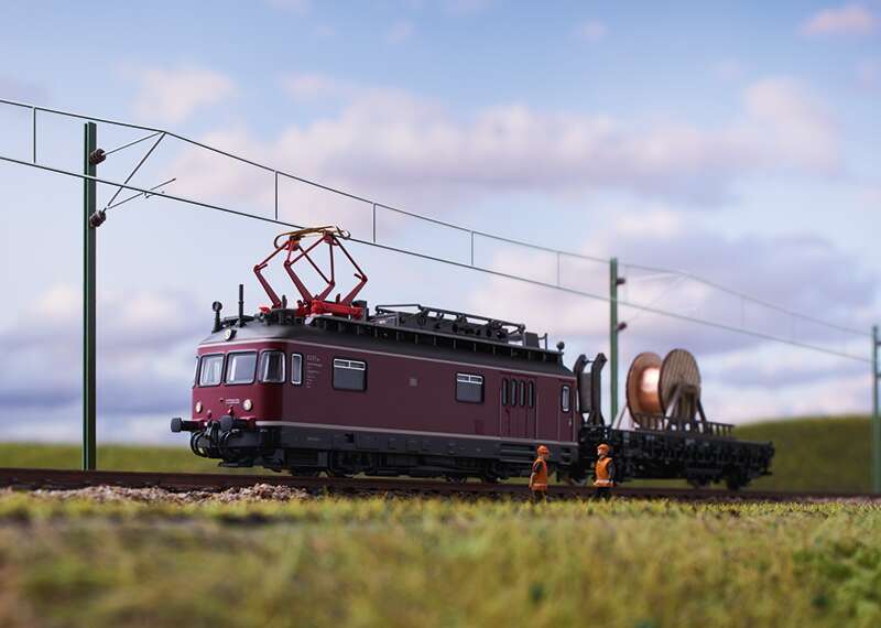 Powered Catenary Maintenance Rail Car with a Catenary Construction Car