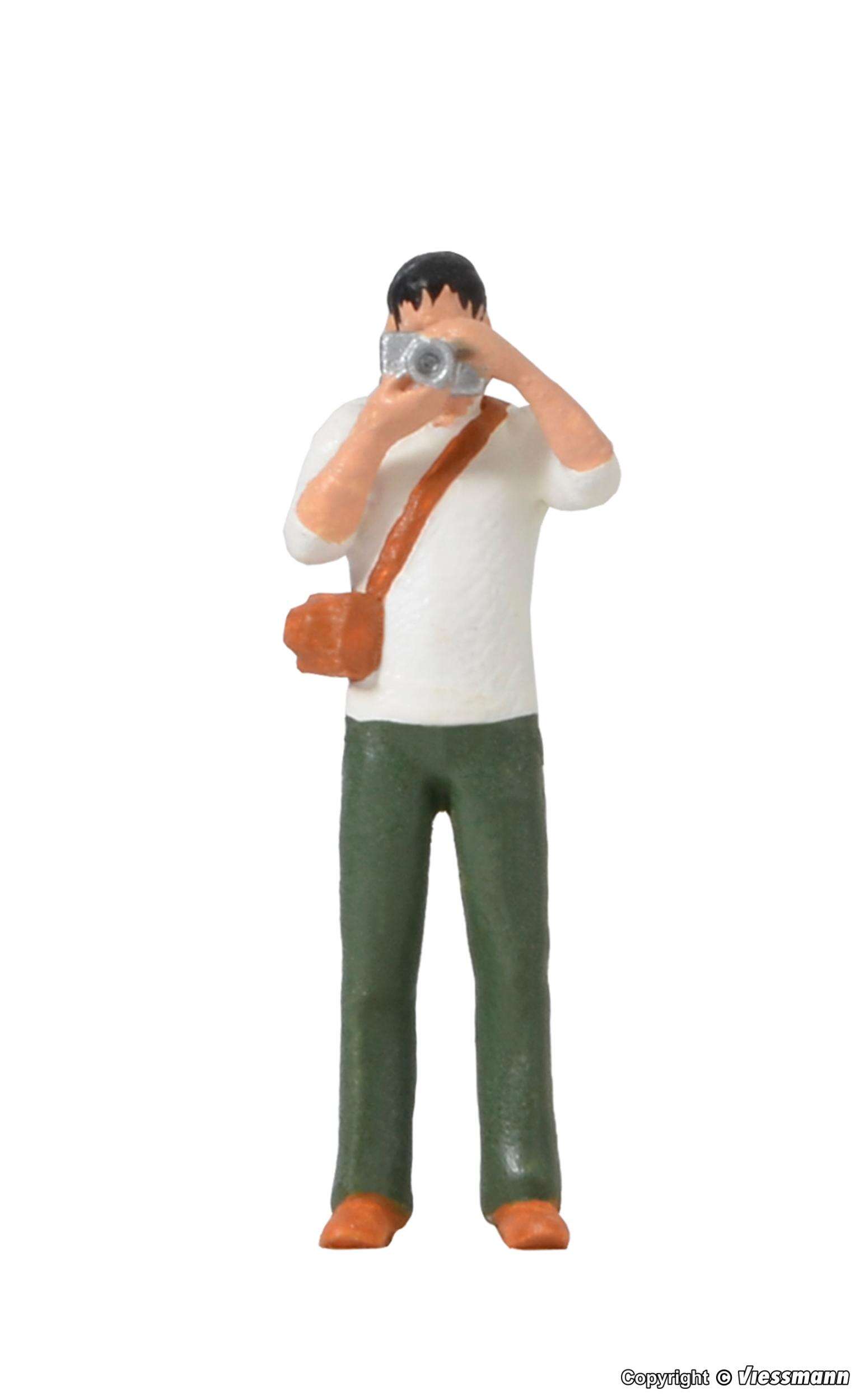 Photographer with equipment and flashlight