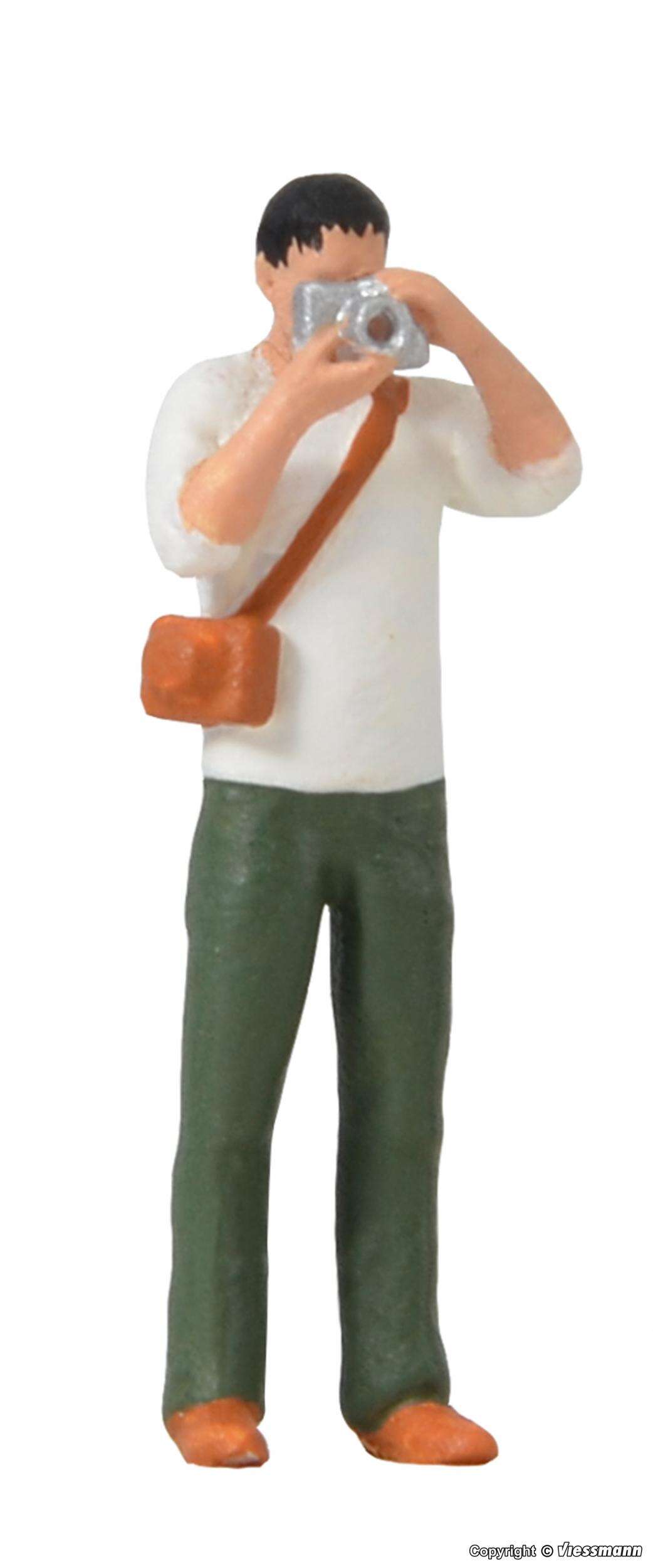 Photographer with equipment and flashlight