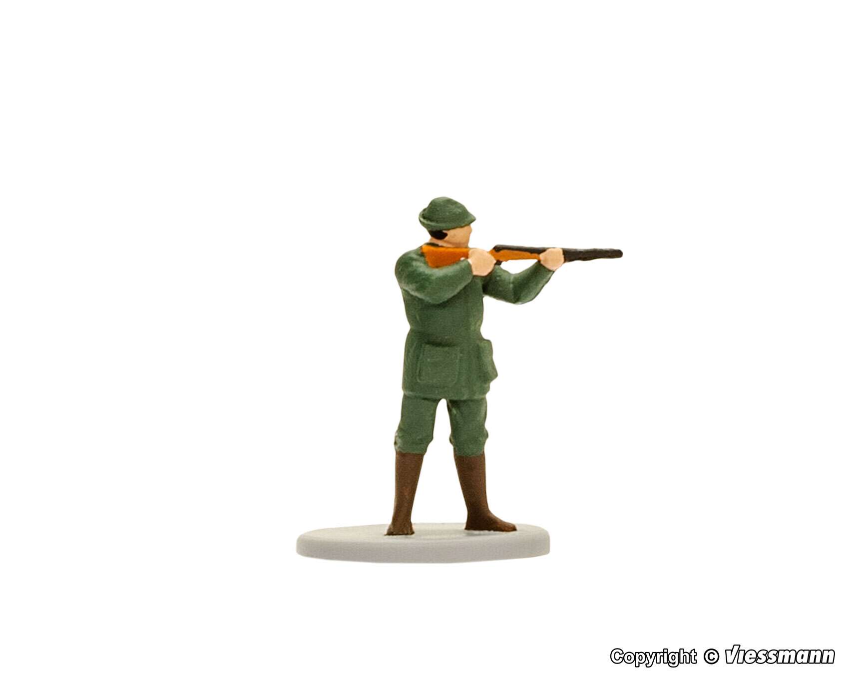 Huntsman with gun and muzzle flash