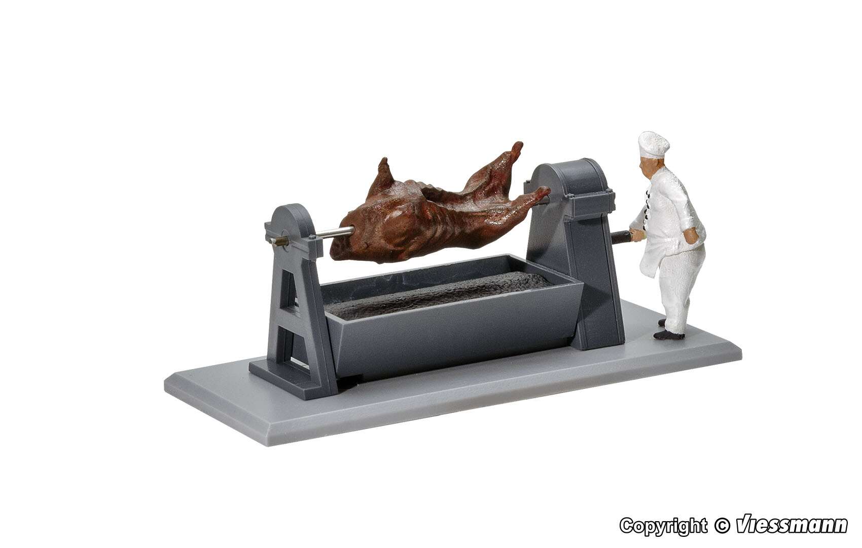 Grill with rotating bullock and glowing embers