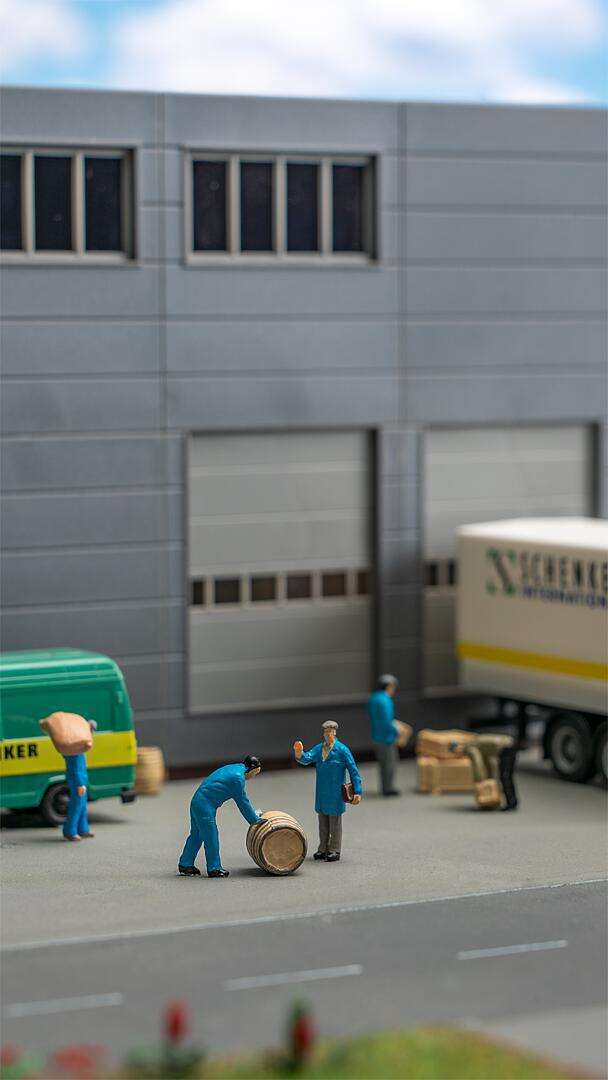 Freight workers with parcels and barrels